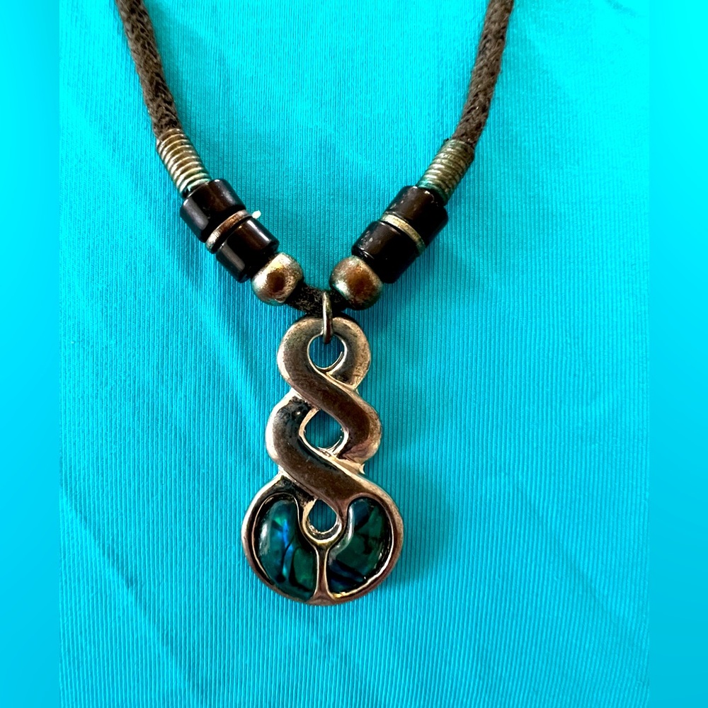 Men or woman’s necklace. Tribal art with silver and mother of Pearl accents.